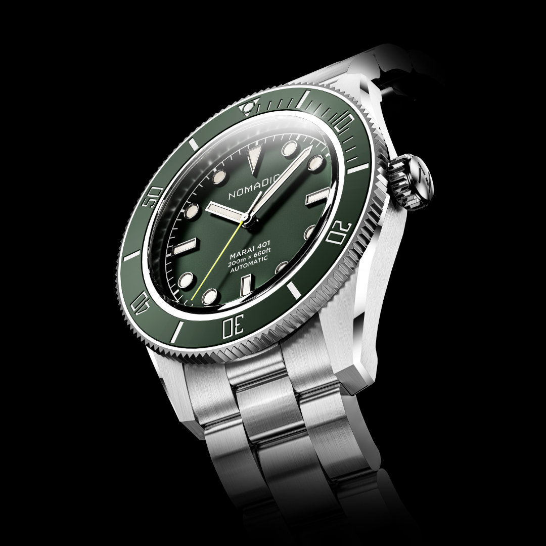 Silver wristwatch with a green bezel and face on a black background.